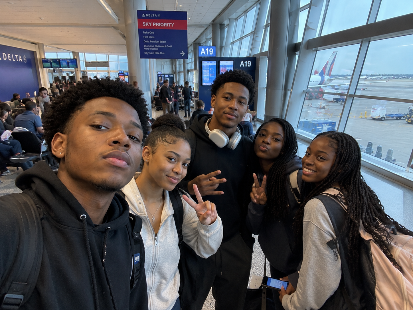 Lexbridge cohort at the Delta Sky Priority gate before departure